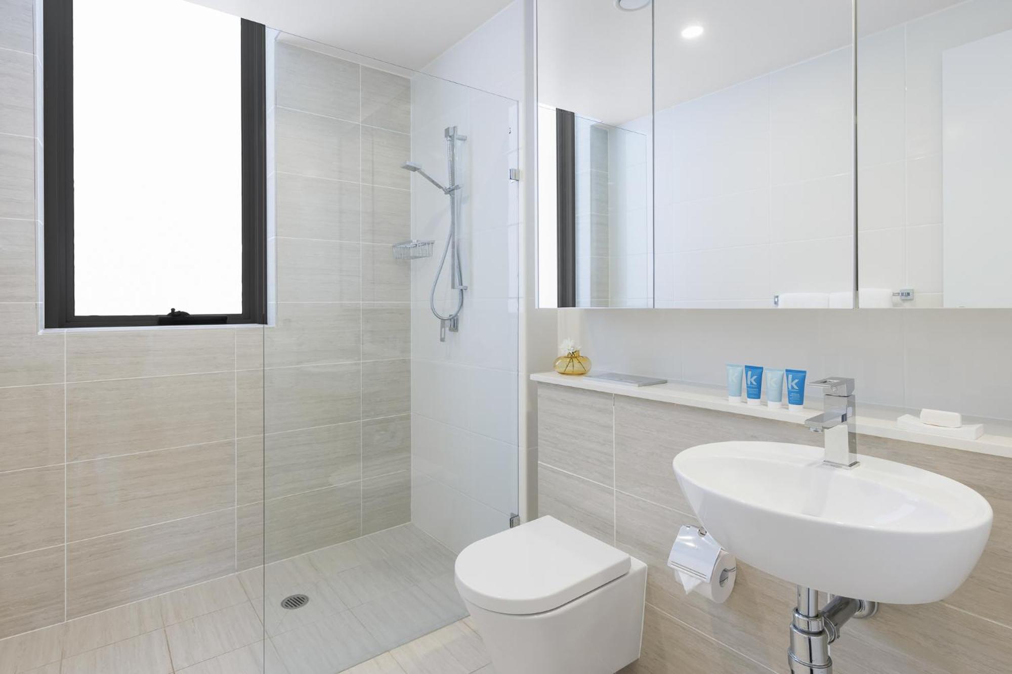 Meriton Suites Zetland Sydney Phòng bức ảnh A modern bathroom
